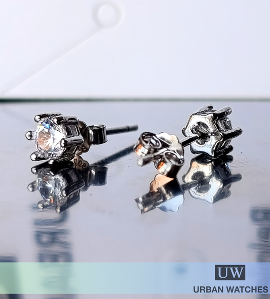Aretes Zircón 4mm en garra de plata 925
